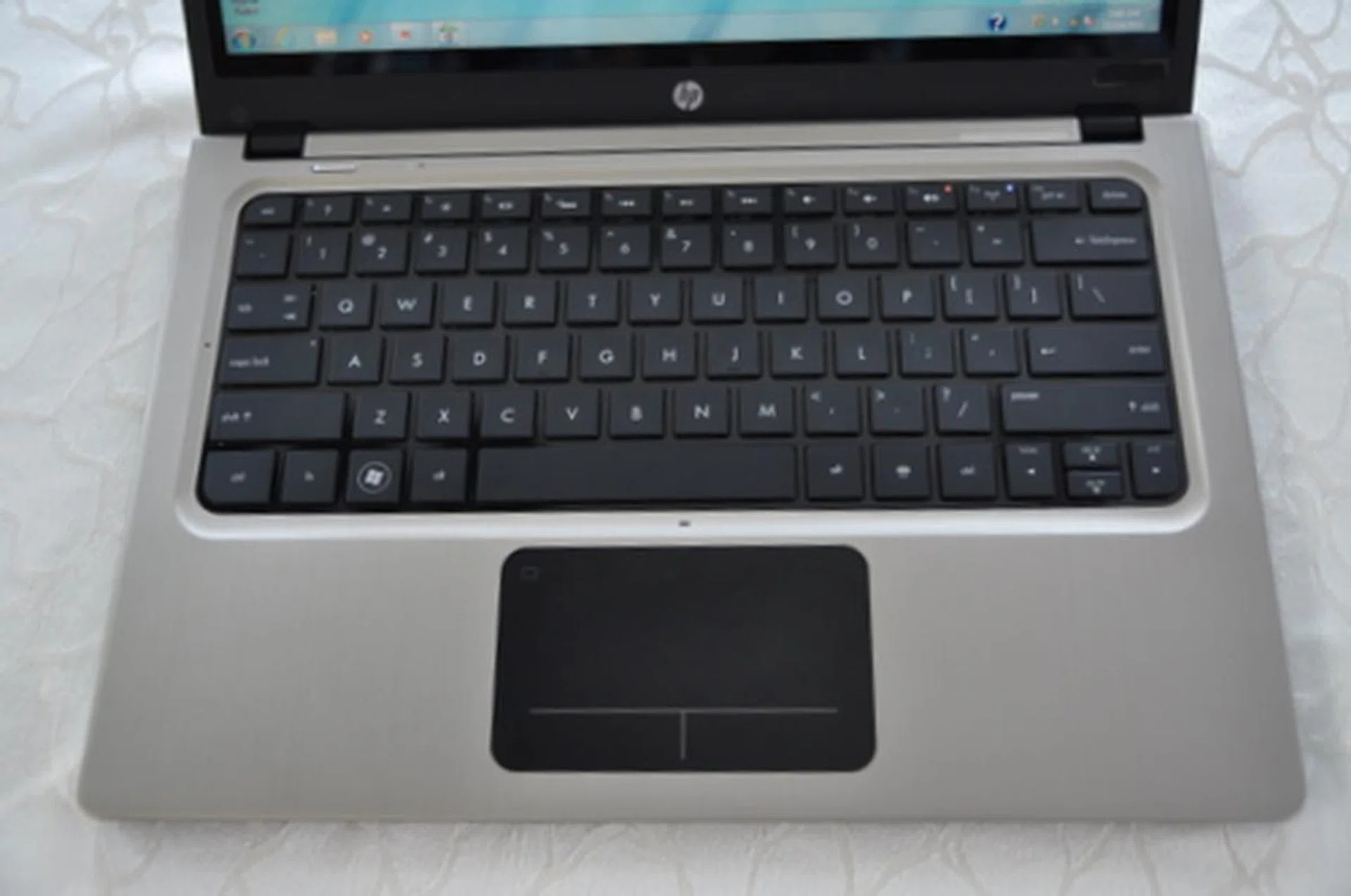 The trackpad on the Folio is pretty big, but we feel it could be bigger. Just look at all that empty space, begging to be used!