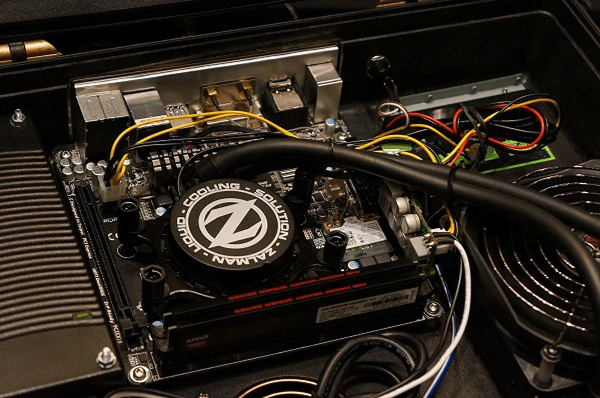 Here's a close-up shot where you can tell it's an micro-ITX system build, complete with an integrated PSU and a sealed water cooling unit by Zalman.