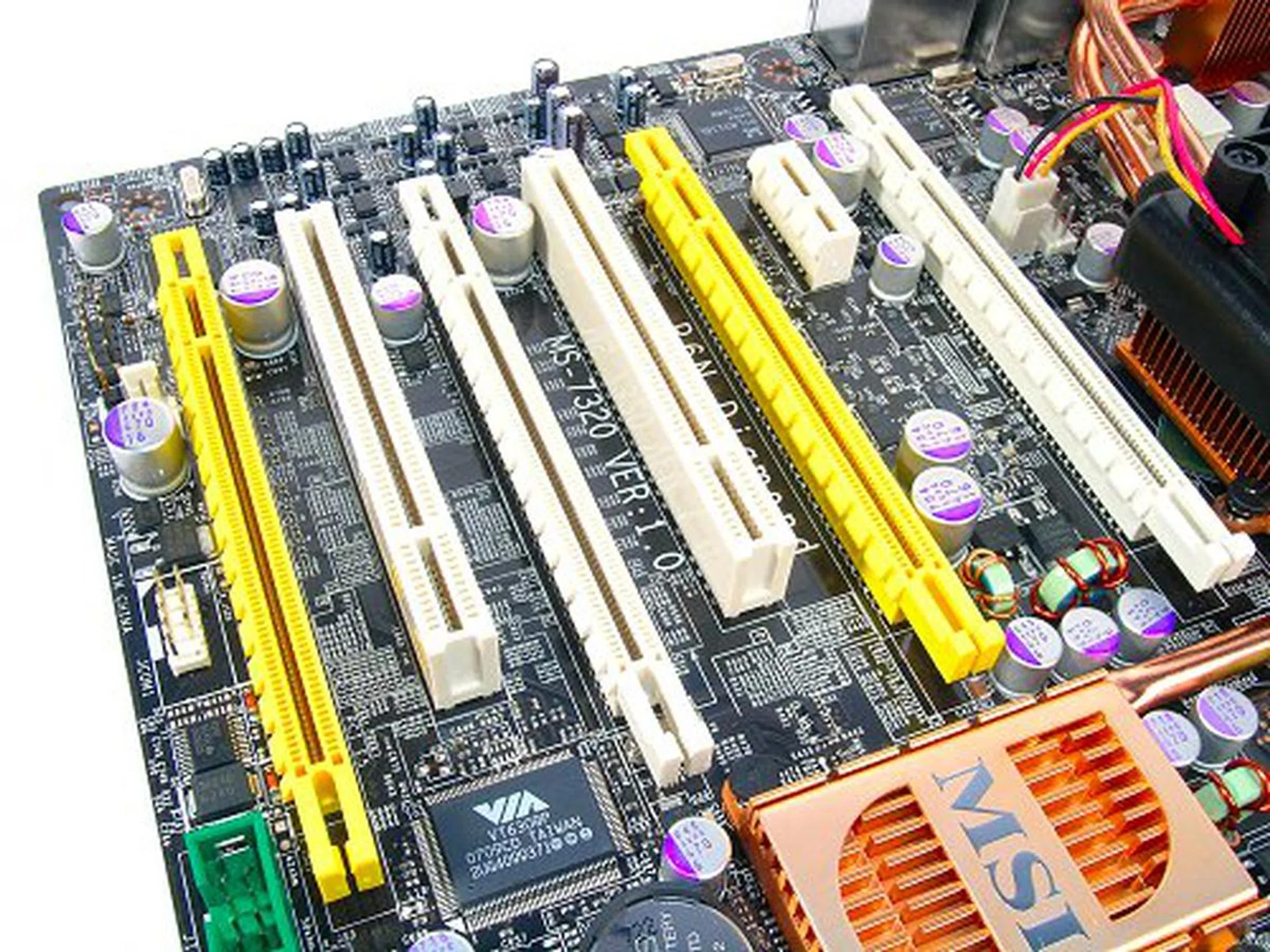 Four PCIe x16 slots for graphics card overload. The middle yellow slot is disabled by default though and only active in a four card configuration.