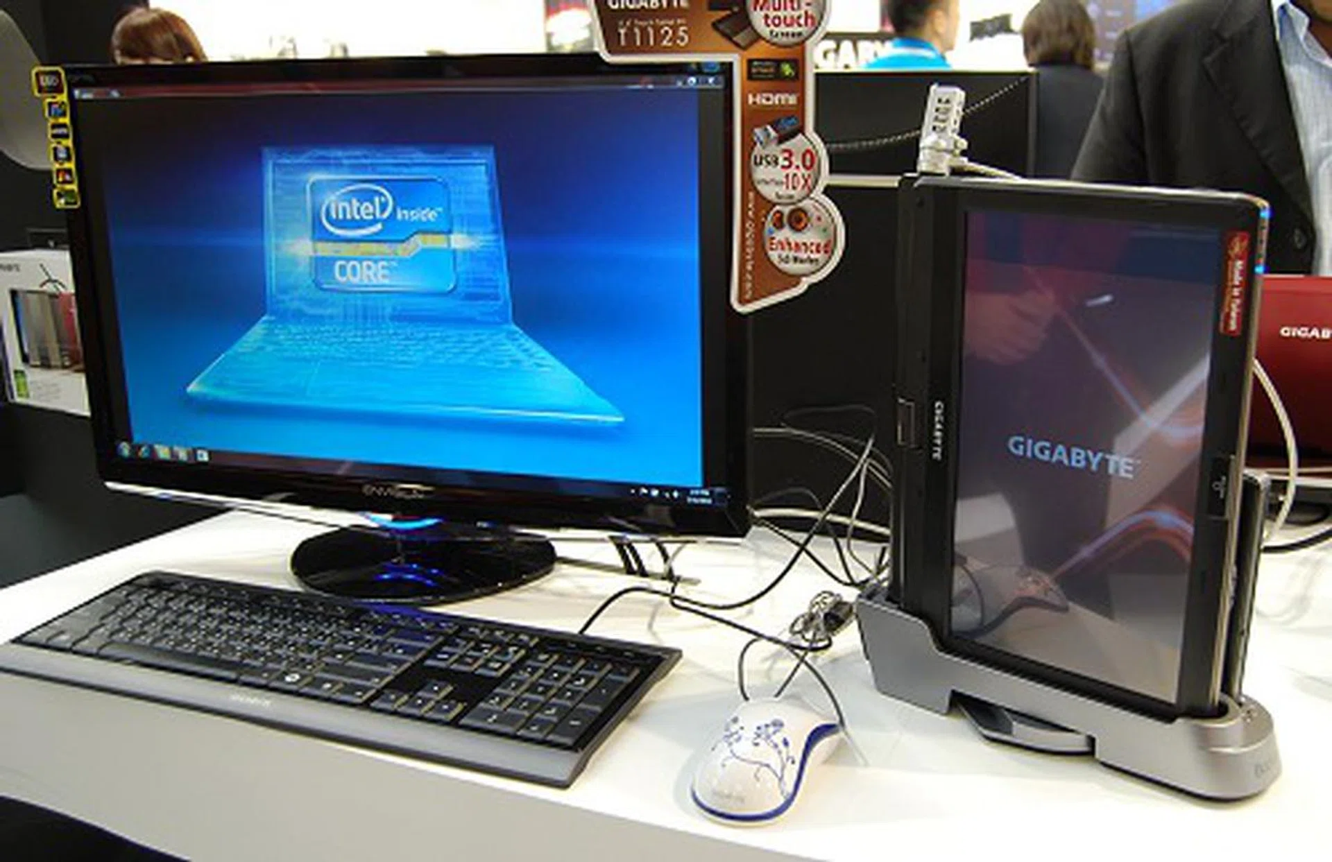 Here we have the T1125 machine docked with all the accessories needed to run it as a desktop - a monitor, keyboard and mouse. An additional function the T1125 in this mode is that its screen can double up as a huge touch pad for an auxiliary input option.