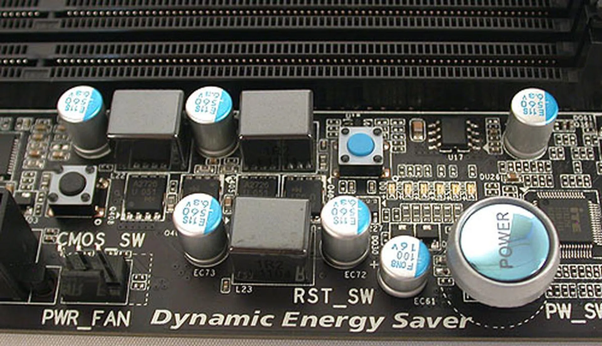 Around the larger power button, there's a black Clear CMOS switch and a small blue button to reset the system. 