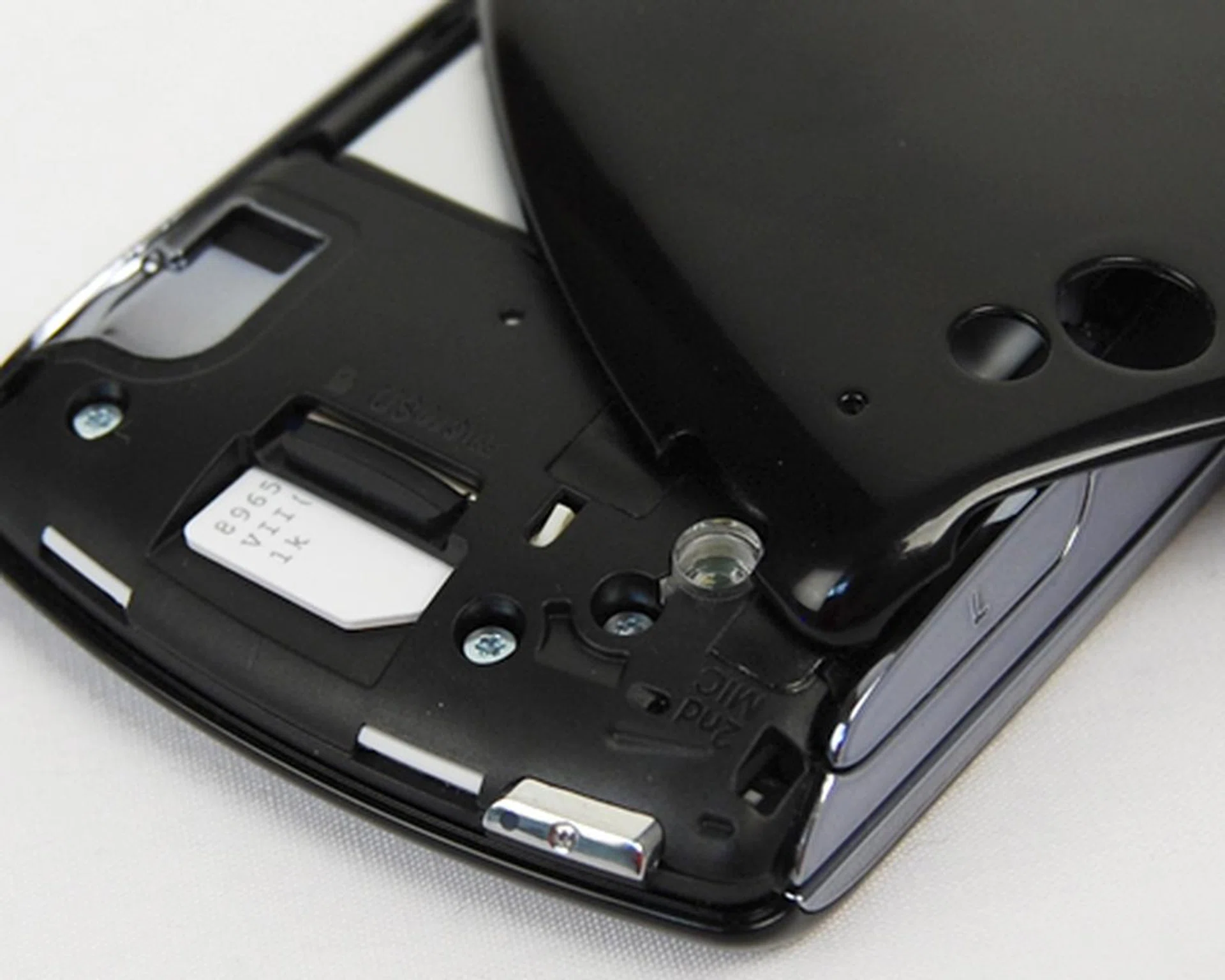 A small plastic switch, which is held down by the battery cover, will be lifted once the cover is removed. Doing so will unmount the microSD card and keep your game data safe from corruption.