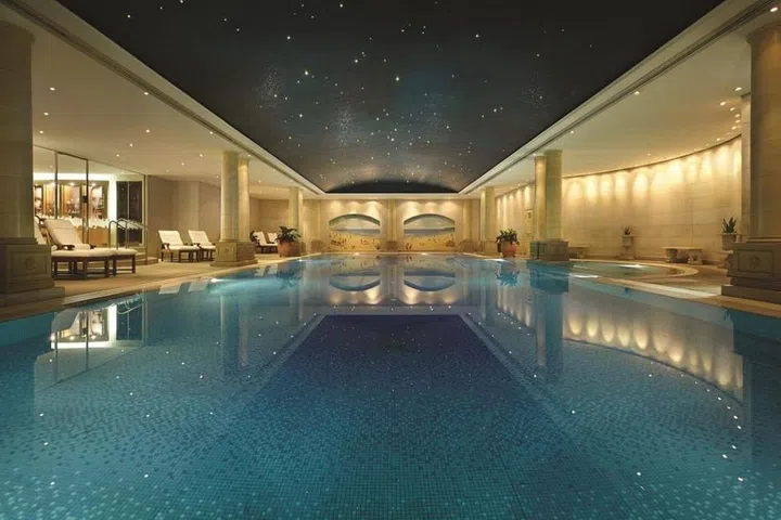 Pale stone columns, beachy murals of Bondi beach, and a star-dappled ceiling line the indoor pool at the Langham Sydney. This 20-meter is perfect for laps or quiet reading, and it's the only pool in Sydney where you can swim under the stars in broad daylight. 