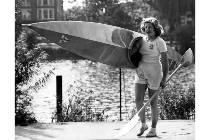 British Olympic canoeist Joyce Web taking her canoe out to train on the Thames River at Richmond. She's seen as one of Britain's best hopes for winning the kayak racing events at the 1952 Olympic games in Helsinki. Photo: Getty
