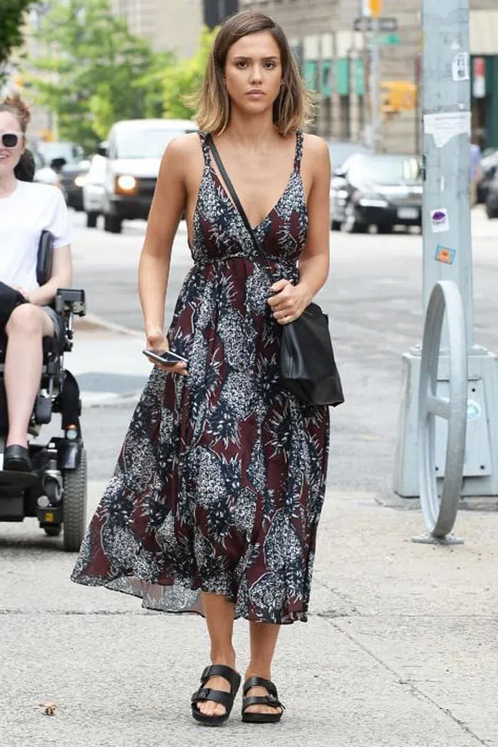 Give feminine dresses a masculine edge by pairing them with chunky sandals. Photo: Getty