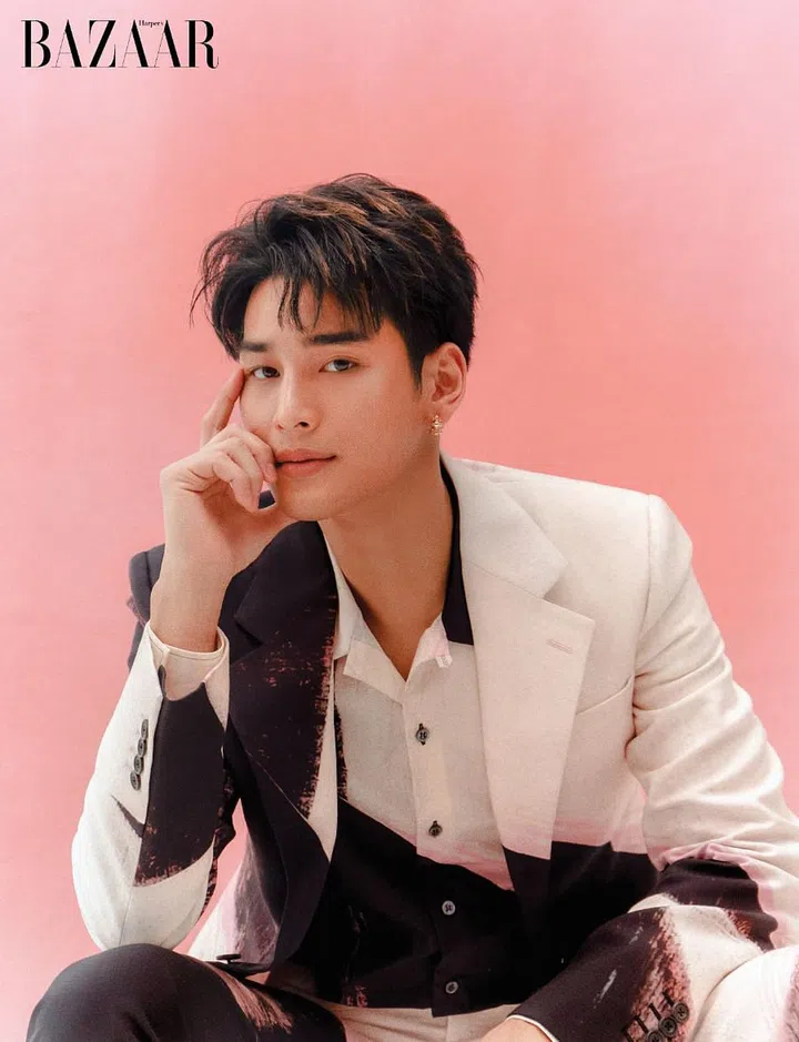Blazer; shirt; trousers, Alexander McQueen. Earring, Cartier.