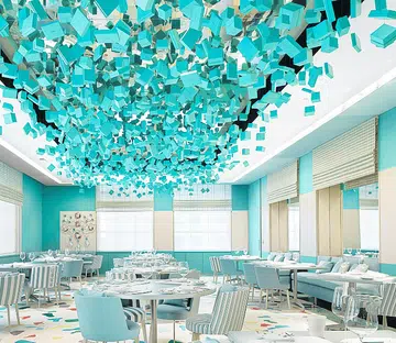 The Blue Box cafe ﻿ with the lovely﻿ decor by architect ﻿Peter Marino who’s﻿ filled the space﻿ with artwork on the walls.