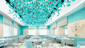 The Blue Box cafe ﻿ with the lovely﻿ decor by architect ﻿Peter Marino who’s﻿ filled the space﻿ with artwork on the walls.