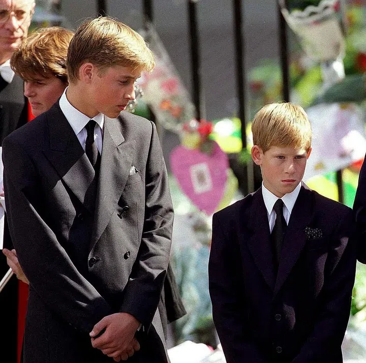 Prince William, 15, and Prince Harry, 12, stand outside of Westminster Abbey at the funeral of their mother, Diana, Princess of Wales. The ceremony took place on September 6, 1997, nine days before Harry's 13th birthday.