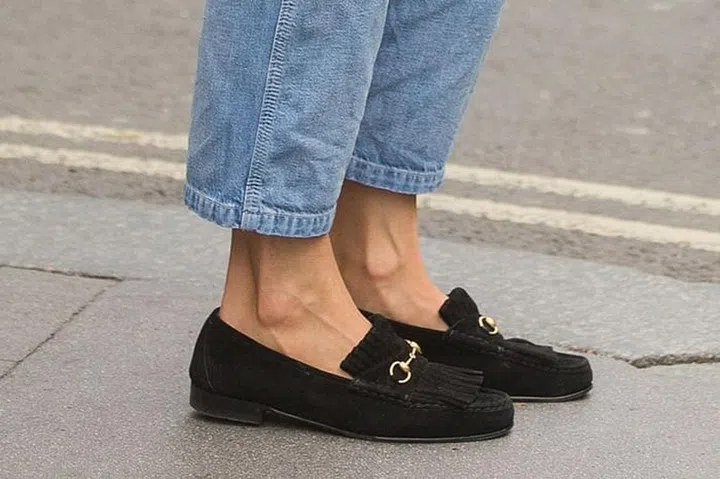 The Queen has long known the value of Gucci loafers, often pairing them with her midi-length pleated skirts and headscarves. Twenty years on, the fashion world has caught up - its latest backless incarnation are seen on the feet of countless editors every Fashion Week.