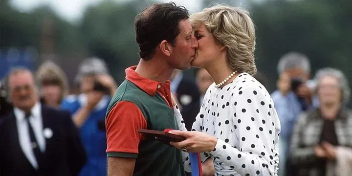 Sharing a kiss after a match at Guards Polo Club in Windsor. Photo: Getty 