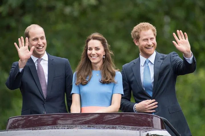 Prince William and Prince Harry wave to the crowd as they attend a celebration for Queen Elizabeth's 90th birthday with Duchess Kate.
Photo: Getty 