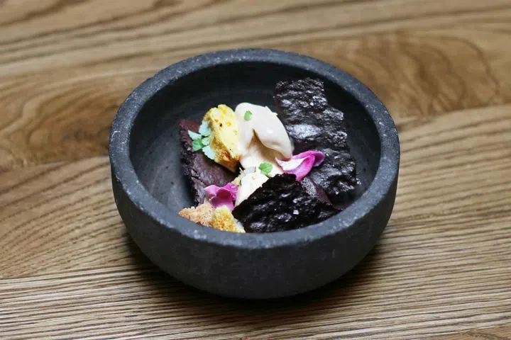 A soy and palm sugar gelato with peanut butter
brittle and honeycomb. Served with a gluten and
dairy-free chocolate brownie and
chocolate custard, topped off with a chocolate
snap and wild flowers from ODP's garden.

Photo: Courtesy of Open Door Policy