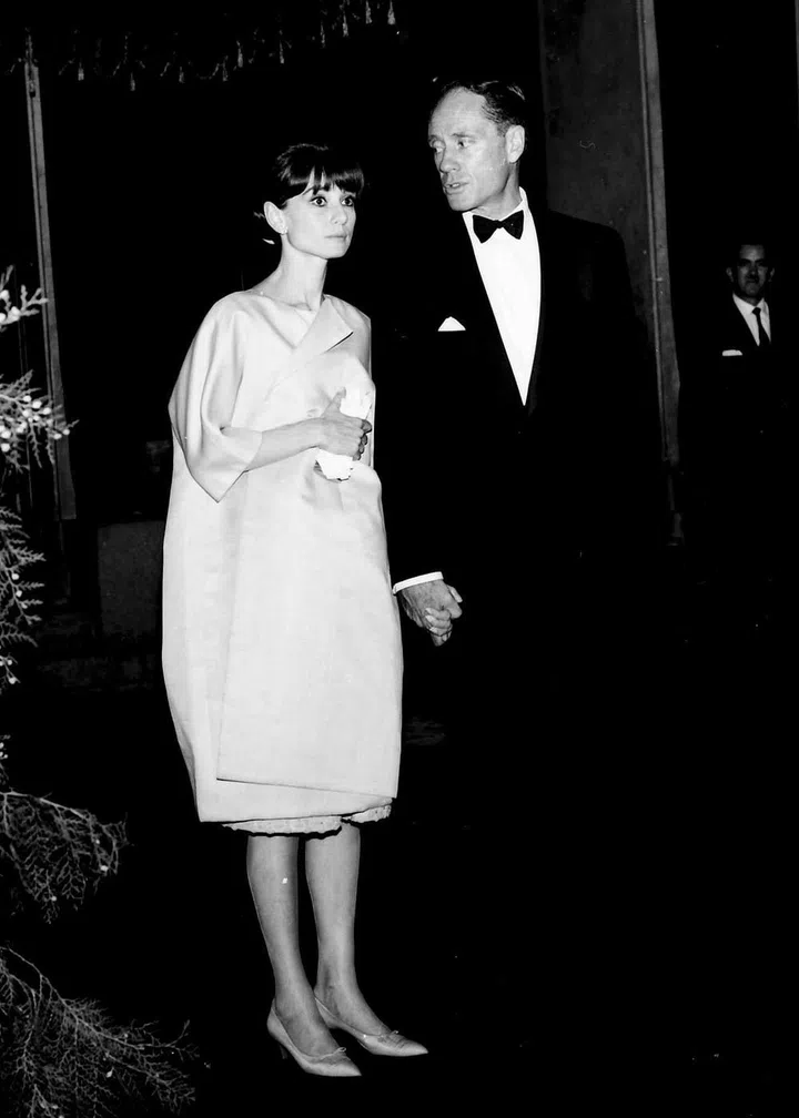 White formal wear for a Spanish holiday with husband Mel Ferrer.