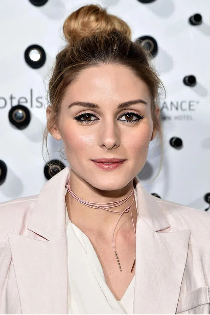 The influencer usually rocks stick-straight strands; teasing them until they were roughed and a little mussed gave her bun heft.
Photo: Getty