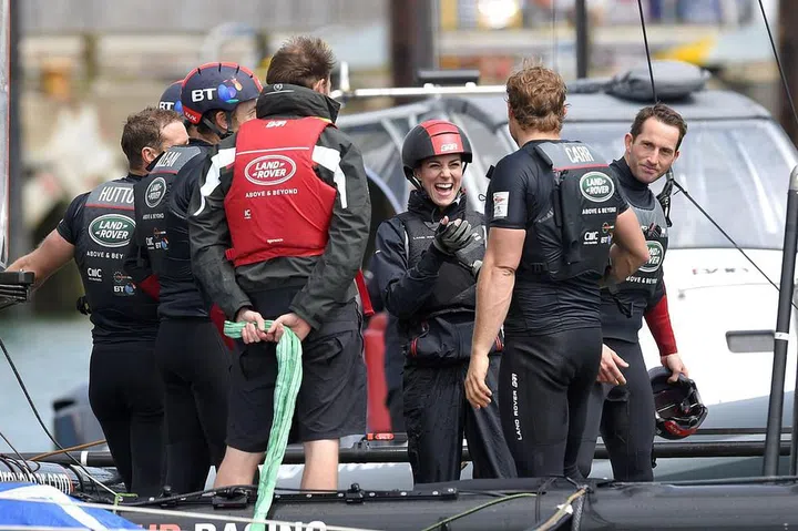 The Duchess has a laugh with sailors onboard the Land Rover training boat in Portsmouth, England.
Photo: Getty