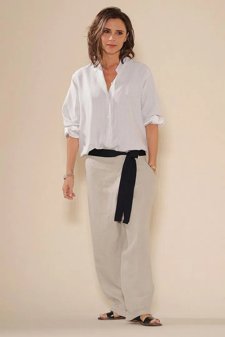 For when it's not warm enough to have everything on show, but too hot to wear something tight, take your cue from Victoria Beckham and wear loose shirts and trousers. Photo: Getty 