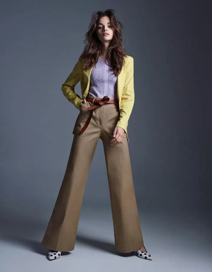 Polyester blazer; viscose top, H&amp;M. Leather belt, Longchamp. Crystal rings, Swarovski. Nylon pumps, Tory Burch. Cotton trousers, Kate Spade New York. 
 
Photo: Wee Khim