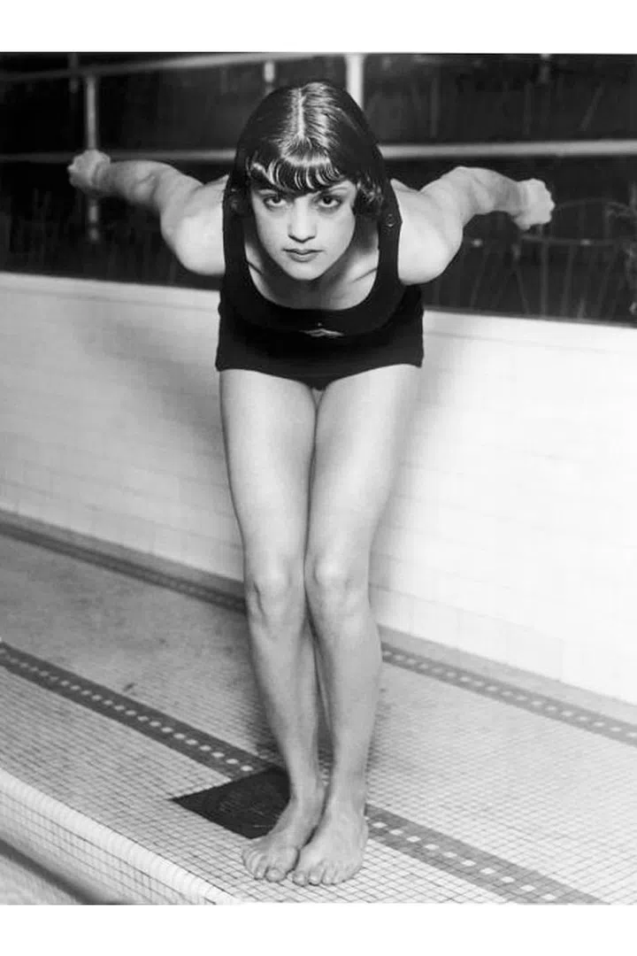 U.S. swimmer Jane Fauntz ready to plunge into the pool in Chicago, 1928. At this time, women's swimsuits are becoming more streamlined for water sports, and females are no longer prohibited from the sport for showing their legs (like they were in the 1908 Stockholm Olympics). Photo: Getty