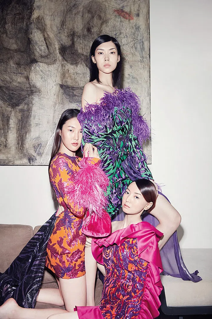With flounces, feathers and fluoro pops, Pornchanok’s party dresses are for making a splash. To craft such standout statements, she employed intricate techniques such as heat-transferring velvet, glitter and rubber.
