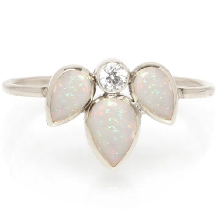 14kt gold ring with opal and diamond, $540, zoechicco.com.