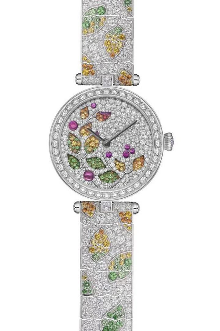 Van Cleef and Arpels

Changing seasons provides the color palette for the inventive manually wound mechanical "Lady Jour des Fleurs" by Van Cleef and Arpels. The diamond-encrusted case slowly reveals the turning multicolor sub-dial, made visible through translucent leaves on the upper dial. The high jewelry watch and bracelet feature yellow and pink sapphires, tsavorite, spessartine garnets, spinels, and miniature painting to magical effect.
Van Cleef and Arpels "Lady Jour des Fleurs." Price Upon Request. Available at Van Cleef & Arpels, 877-VAN-CLEEF or vancleefarpels.com.
Photo: Van Cleef & Arpels