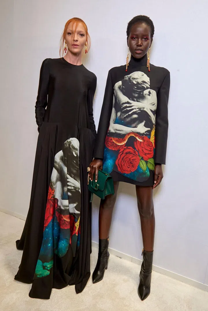 Pierpaolo Piccioli continued his collaboration with Undercover’s Jun Takahashi, who provided the season’s central motif of kissing lovers overlaid with roses. Expanding on both the concepts of love and partnership, Piccioli also invited four poets to work on an anthology, Valentino On Love, from which lines were plucked and then printed or embroidered onto linings, between layers, or inside sleeves—secret love messages from the wearer to her own self. Individuality has been a recent
obsession for Piccioli and here he hammered home the message with a collection of incredible breadth. On the youthful spectrum, ultra-leggy pieces in trapeze shades— vibrant pops of tangerine, fuchsia and buttercup; and fluttering layers of tulle. On the polished end were fluid, decorous silhouettes extending all the way to mid-calf or the
floor, exuding an almost monastic elegance.