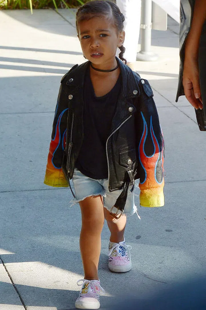 For a family day out running around with cousin Penelope at LACMA, North's look was on fire—literally—in a flaming leather moto jacket, denim cutoffs, sneakers and her recent go-to accessory: a choker. The tot brought new fashion meaning to the phrase "terrible two's" with a moto jacket tougher than you'll ever be. Photo: Splash