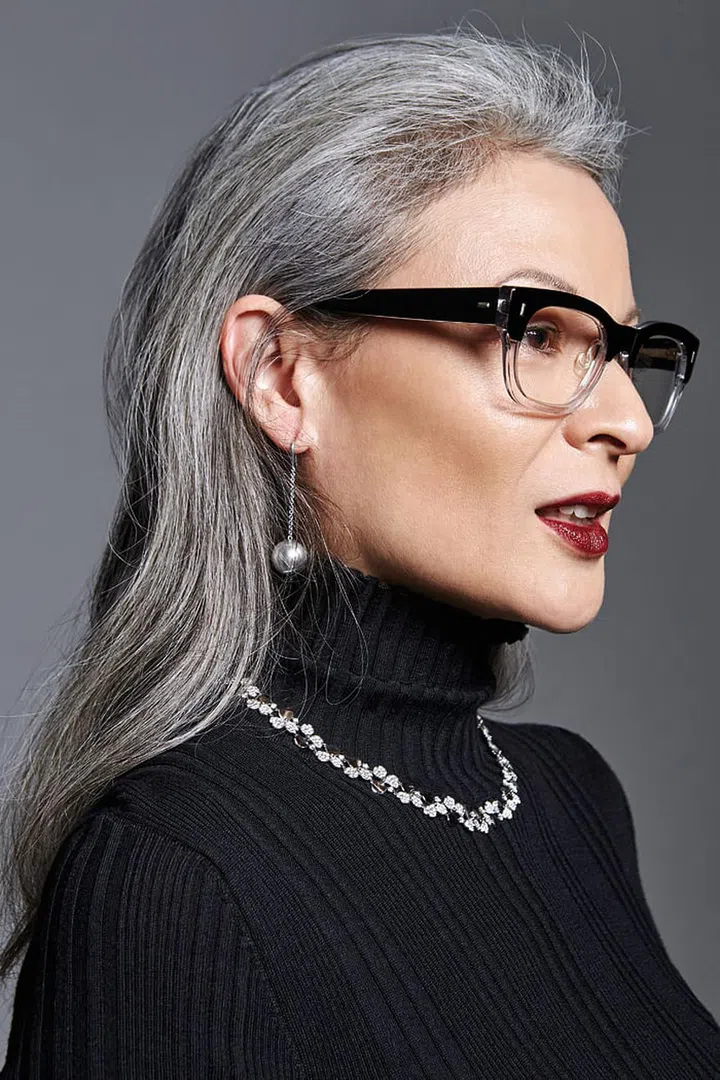 Blommaert wears her
own Louis Vuitton
turtleneck sweater.
Silver HardWear Ball
hook earring; platinum
and diamond Paper
Flowers Diamond Cluster
necklace, Tiffany & Co.