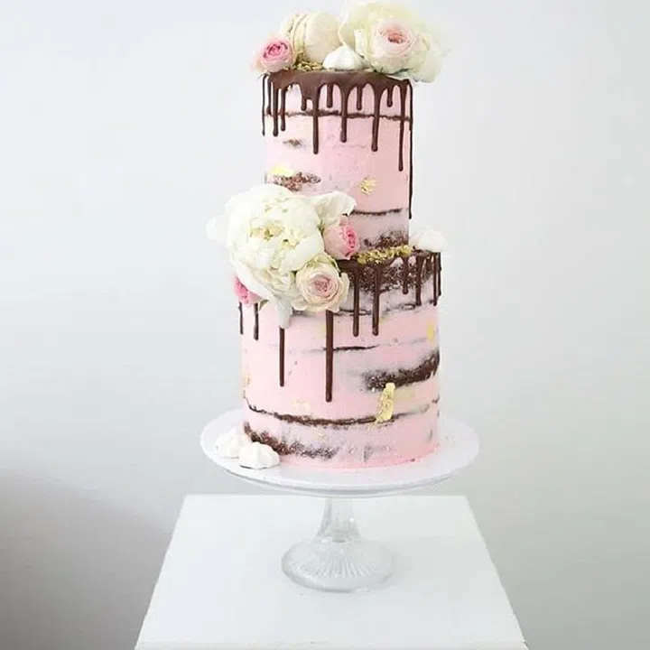 You can even make your wedding cake dusty pink. Case in point: This super on-trend naked drip cake. Photo: Instagram, @sweetbakes_