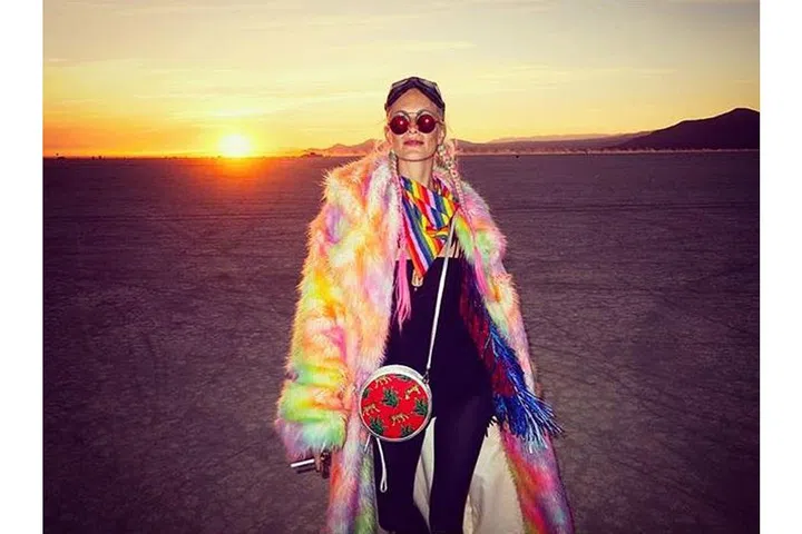 Poppy Delevingne coordinated her pink-and-green plaits with her fluorescent fuzzy coat.