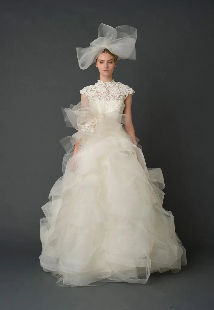 Vera Wang is arguably the inventor of modern-day American wedding dressing, and this silhouette is possibly the closest to Pippa's Deacon creation already out there. Wang is carried in the United Kingdom by Brown's Bride, the country's top bridal boutique, which Pippa likely visited in her search for the perfect look prior to opting for something custom. Considering this gown was on the market and readily available for try-ons, we might dare to say that a fitting of this dress inspired the bodice and neckline she wore down the aisle.

Vera Wang Bride "Henriette" gown, price upon request, verawang.com