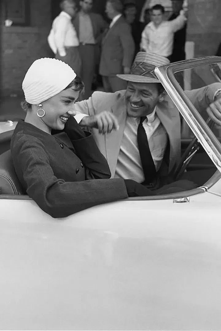Returning from a trip to Paris, Sabrina (Audrey Hepburn) shows off an elegant, '50s-approved makeover that we still envy to this day. With her skirt separates, ball gowns, and boating looks, Sabrina's outfits still feel fresh over 50 years later.

Photo: Getty