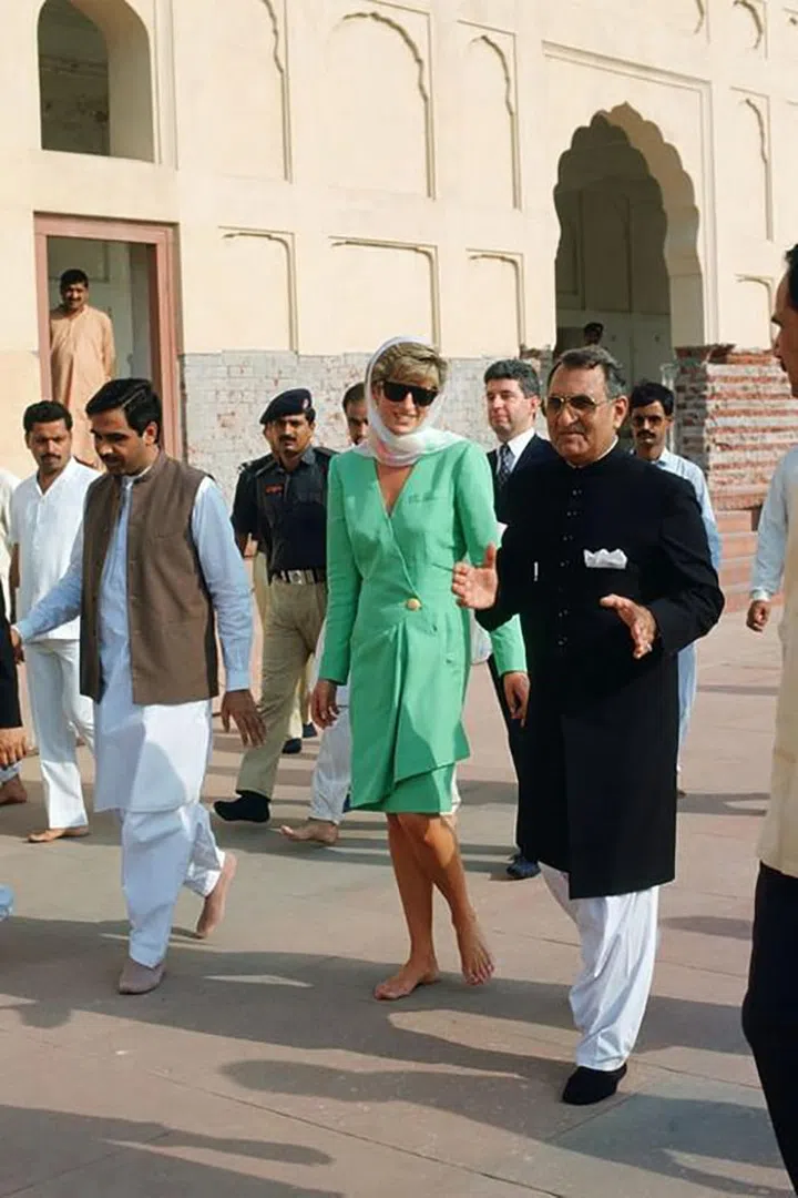 Walking barefoot and in a headscarf while visiting the Badshahi Mosque in Lahore, Pakistan.

