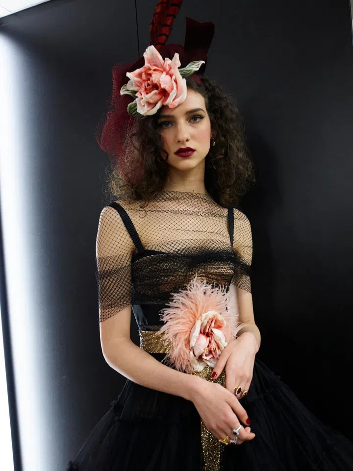 Dolce & Gabbana shows are usually campy spectacles filled with celebrities, celebrity off spring, and influencers; often focused on a single facet of Italian-ness—religion, food, postcard-perfect destinations—interpreted in a multitude of playful ways. This time, they dialled back on the theatricality to riff on the format of an old-school couture presentation complete with a narrator describing the looks as they paraded past. The collection itself was divided into clear segments corresponding to the different needs of their clients. First up was tailoring in mannish proportions, followed by boudoir-inspired dressing gowns, baby-doll dresses and pyjama sets. These were closely followed by a checklist of Dolce & Gabbana signatures and best-sellers—from vampy leopard prints and lush florals, to monochrome polka-dots, opulent brocades and sensuous black lace.