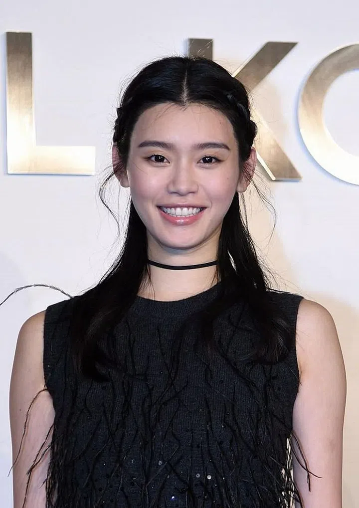 Start with a centre part and braid two small sections of your hair. With the rest of your hair down, secure both sections behind your ears, using bobby pins for a modern spin on milkmaid braids.

Photo: Getty Images