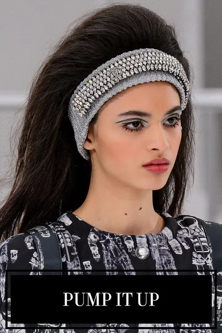 You know what they say: the bigger the hair, the cooler you are. Maybe the real expression is something vaguely religious, but if there's one thing to do to your hair this season, it's pumping up the volume. At Chanel, it was easy to see where the hair and makeup references came from this for this space travel-inspired season; hairstylist Sam McKnight dubbed the voluminous hair "Chanelarella" on Instagram. The sky-high, '60s-inspired volume could only be achieved by one technique: teasing. And then more teasing. McKnight and his team backcombed and fluffed the hair until the last second the models hit the runway. A headband—either plain black or bedazzled—was then secured right along the hairline. 