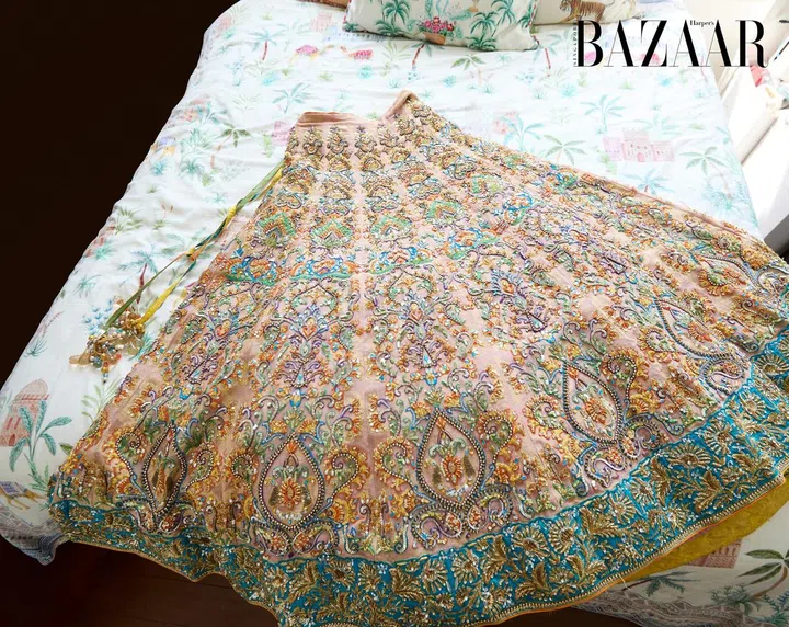A close-up of her hand-beaded Nomi Ansari lehenga skirt.
