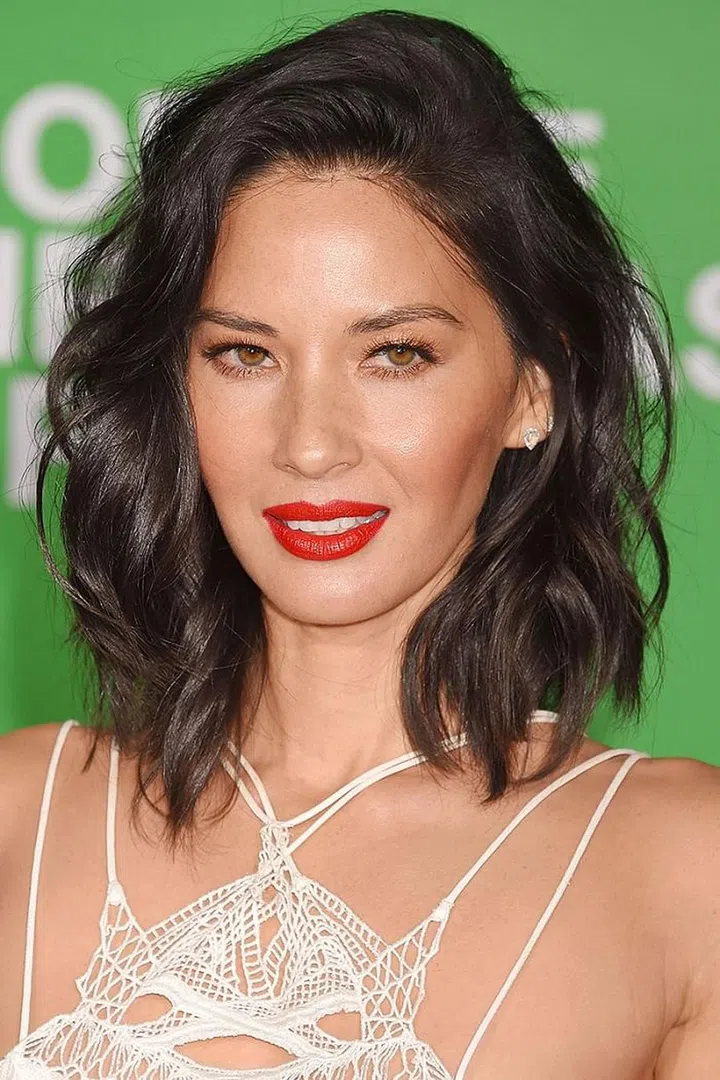 You don't need long hair to get bombshell waves. Using a tapered curling iron, create loose bends by curling them in opposite directions (so away from your face, then toward your face). This makes the waves look purposefully tousled. 