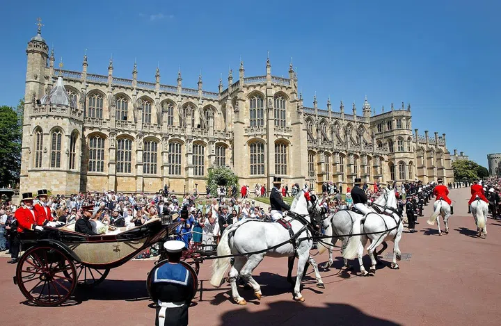 Prince Harry, Duke of Sussex and Meghan, Duchess of Sussex travel in an Ascot Landau carriage 