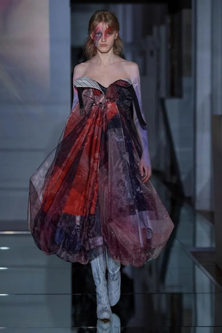 John Galliano had anarchy on his mind. With his latest Artisanal collection, he shattered what remained of the gender binary, sending out boys in shrunken sweaters, hot pants, garter belts and thigh-high boots. He also torpedoed the tropes of couture. The wasp waists and full-skirted looks called to mind the mid-century New Look, but their components and the manner in which they were employed were resolutely of the 21st century. Things were never quite what they seemed. What looked like houndstooth, tweeds and furs were actually prints transferred onto shimmery semi-sheer fabrics then overlaid on wool and mohair, like filters. Lace was alluded to by punching holes into garments. Trousers got cut up and remixed into bustier dresses. A trench coat was twisted into a one-shouldered dress. It was all beautifully chaotic and resulted in a sensory overload—couture for the modern times. 

Photo: Courtesy