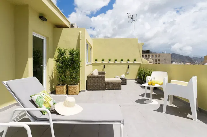 Tenerife is the largest of Spain's Canary Islands, just off the coast of West Africa. Known for its momentous Carnaval, the island is also home to a number of temples, museums, and old colonial towns. Take in the spectacular views with this color-drenched penthouse apartment. Photo: Airbnb