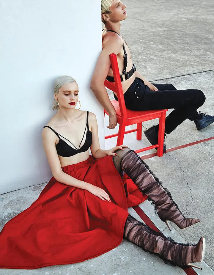 Painted cotton skirt, Prada. Metal earrings, Salvatore Ferragamo. Silk and leather boots, Off-White c/o Jimmy Choo. Bra; stockings, stylist’s own