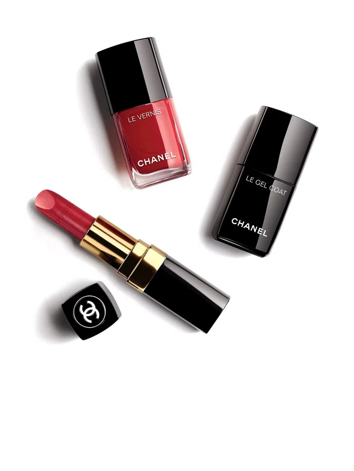 Or try the timeless Rouge Coco for long-lasting wear and all-day hydration. Shown here: Rouge Coco in 442 Dimitri, $49; Le Vernis is 500 Rouge Essentiel, $39; Le Gel Coat, $39. 