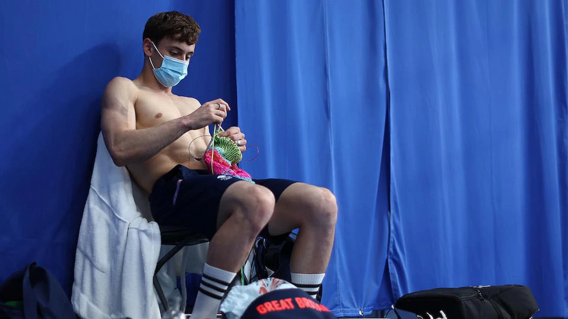 Thomas Daley of Team Great Britain is seen knitting before the Men's 10m Platform Final on day 15 of the Tokyo 2020 Olympic Games at Tokyo Aquatics Centre. (Photo: Clive Rose/Getty Images)