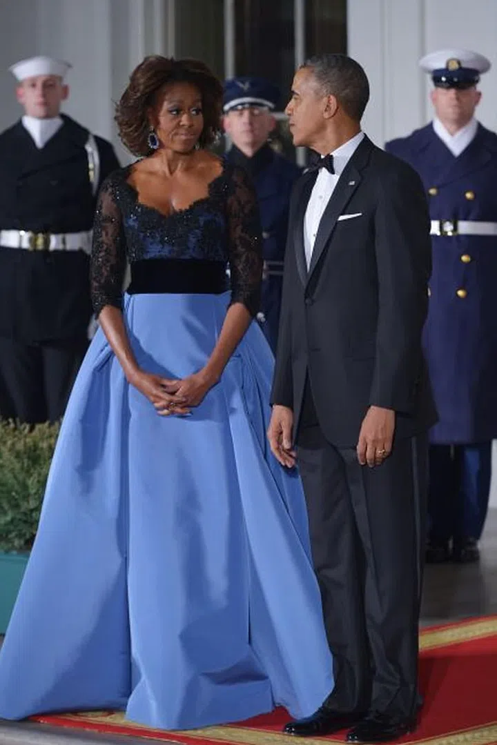 After a year without a State Dinner, the First Lady stunned the nation in this gorgeous Carolina Herrera gown with a sheer, lace overlay and voluminous blue skirt.