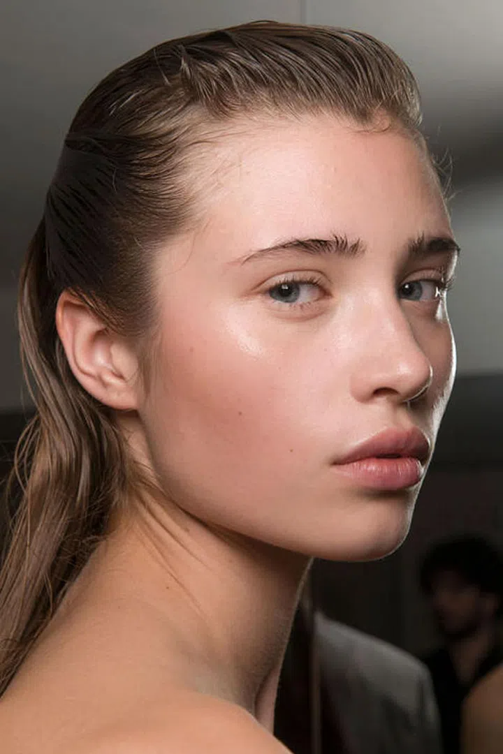 The well-moisturized skin glowed backstage at Olivier Theyskens. 