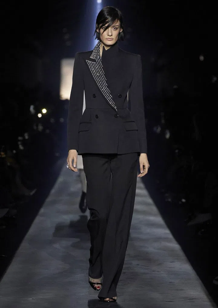 In less than two years, Clare Waight Keller has steered Givenchy towards an elegance that’s closer to the aristocratic spirit of its House founder. Her latest collection further reinforced this vision, starting with cinched suits featuring pronounced shoulders that were either sculpted and rounded, or padded and angular. Balancing the strict suiting were micro-pleated dresses printed with tiny florals, the flounced hems and cuffs adding a charming youthfulness to the
modest silhouettes. Puffed sleeves the size of wings brought couture level drama, but cut in crinkly taffeta and worn with trousers, Waight Keller maintained a decidedly contemporary air of effortlessness.