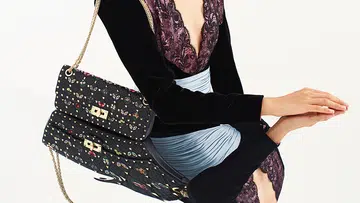 model poses with the new butterfly embroidered valentino garavani rockstud spike