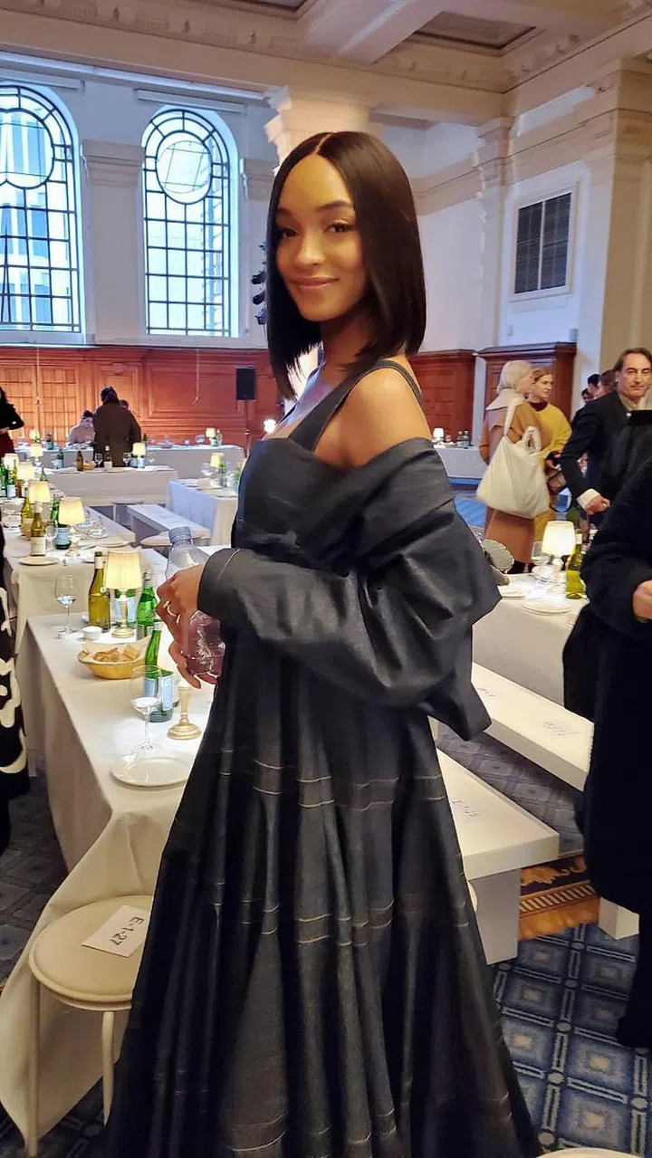 Jourdan Dunn schooling us on how to wear denim for cocktail hour at the Molly Goddard show.